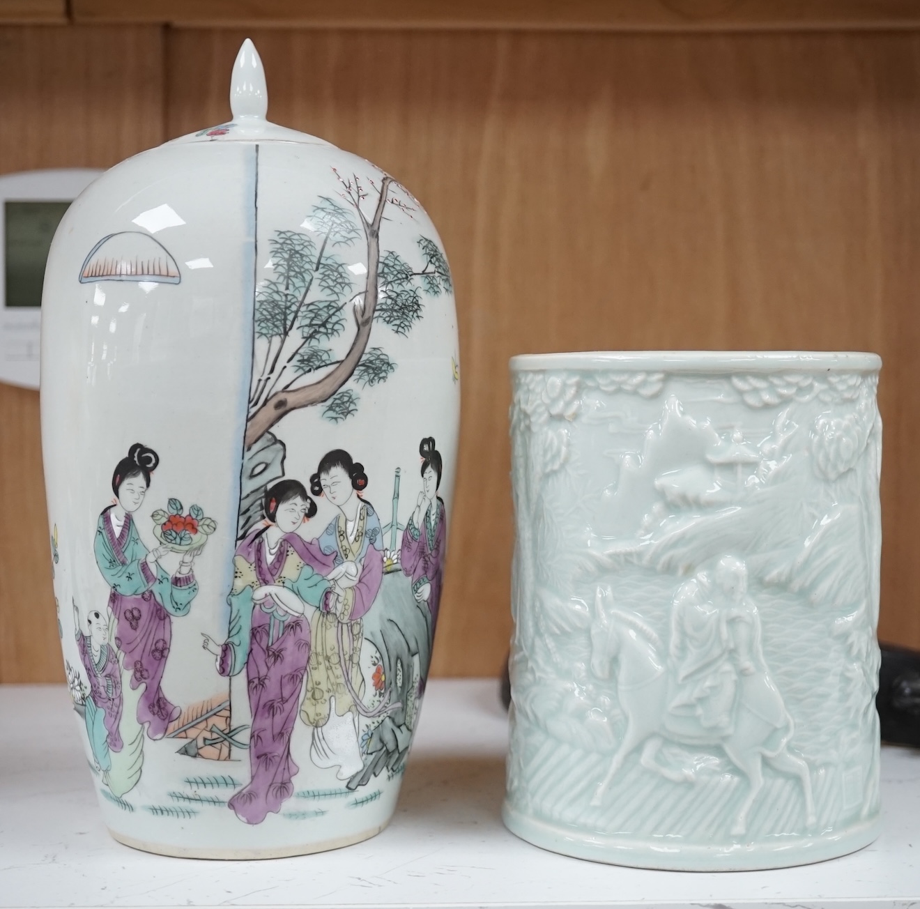 Three Chinese items comprising model of a stringed instrument (Pipa?), a celadon glazed brush pot and famille rose jar and cover, Republic period, 25cm high. Condition- fair to good